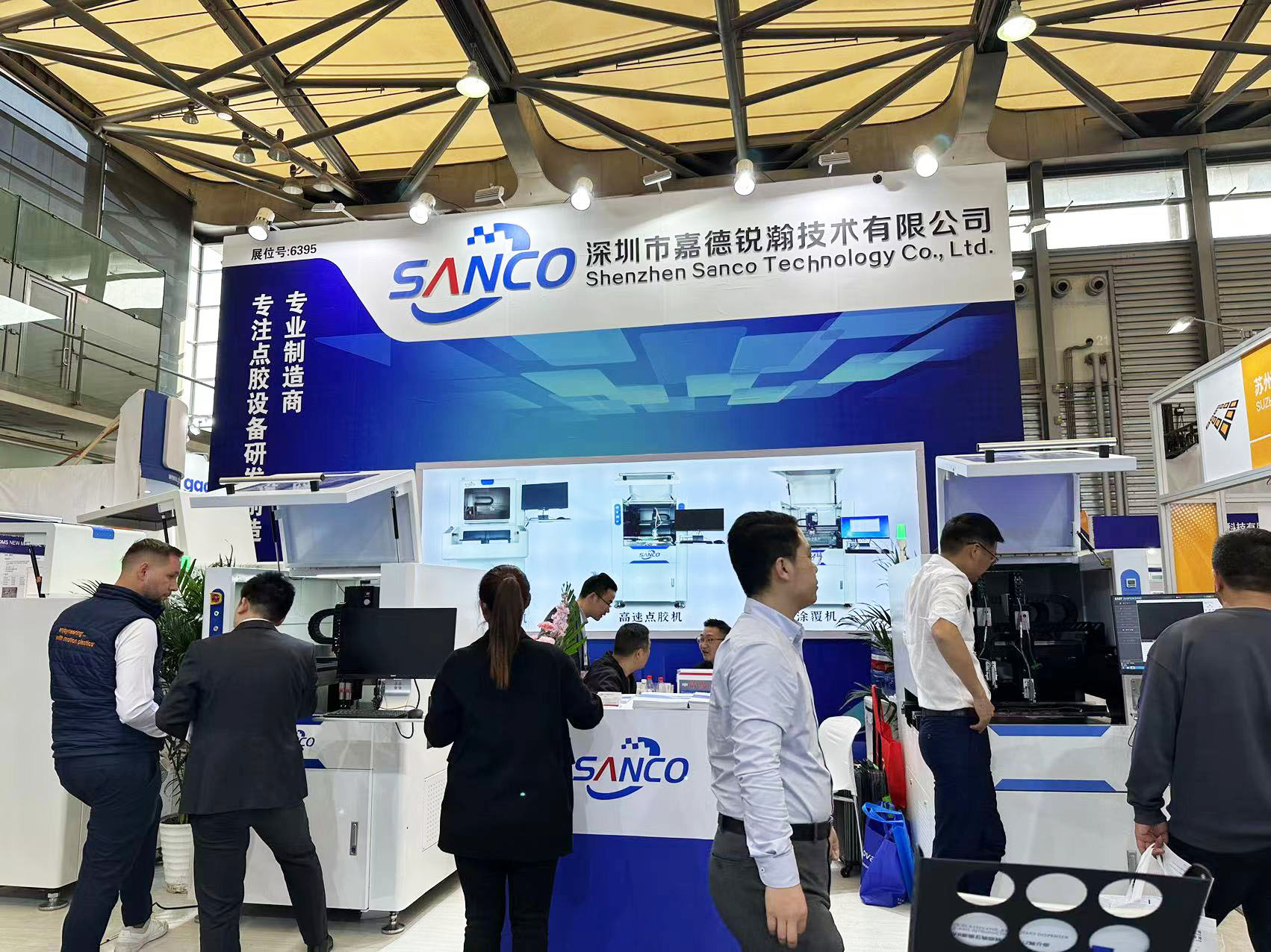 SANCO team meeting with customers discussing precision dispensing solutions