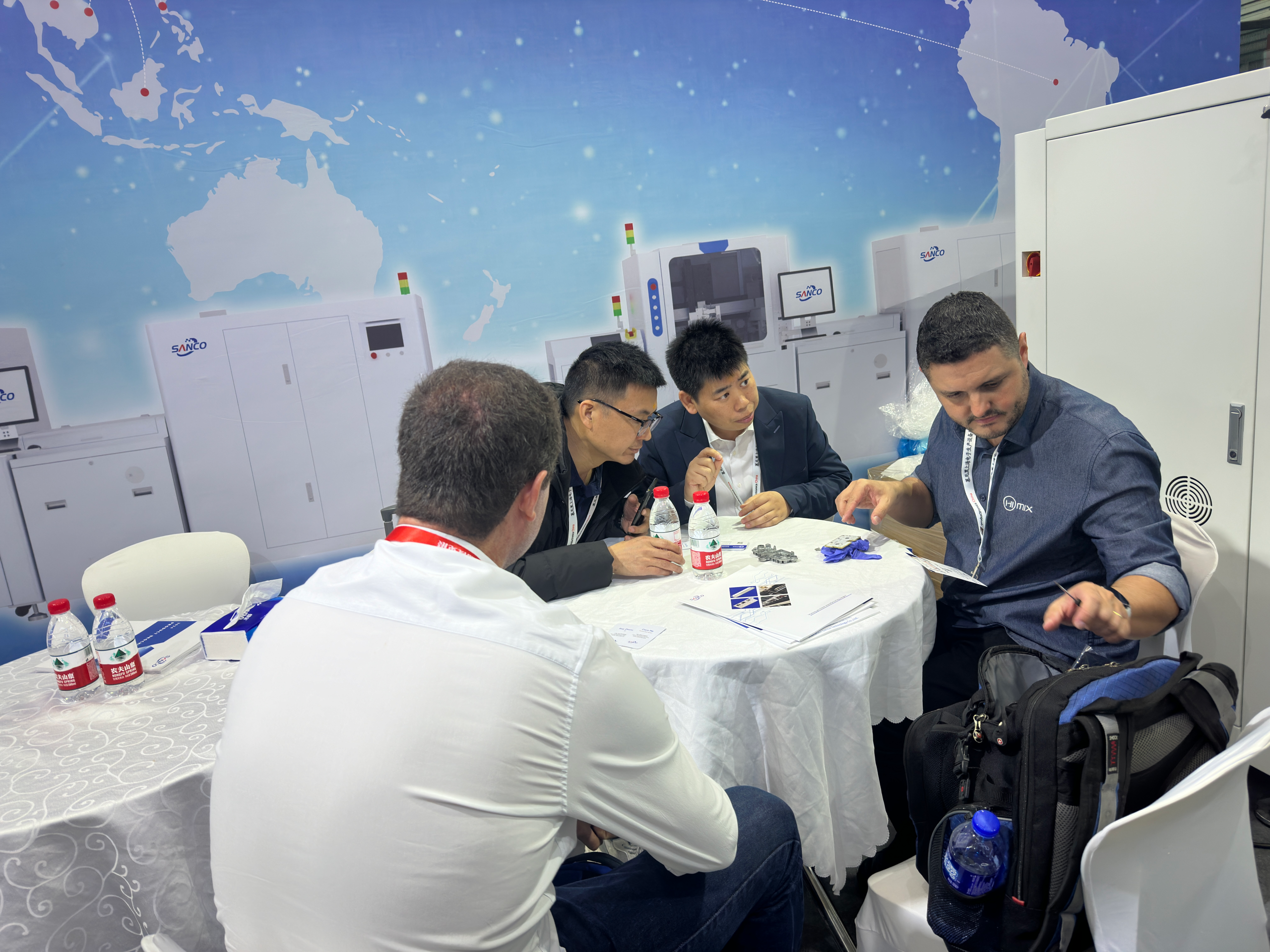 SANCO Technology exhibition booth at international trade show showcasing dispensing equipment